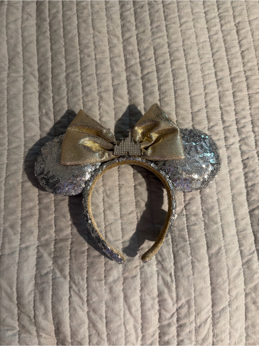 A Disney ears headband photographed for a US resale marketplace listing